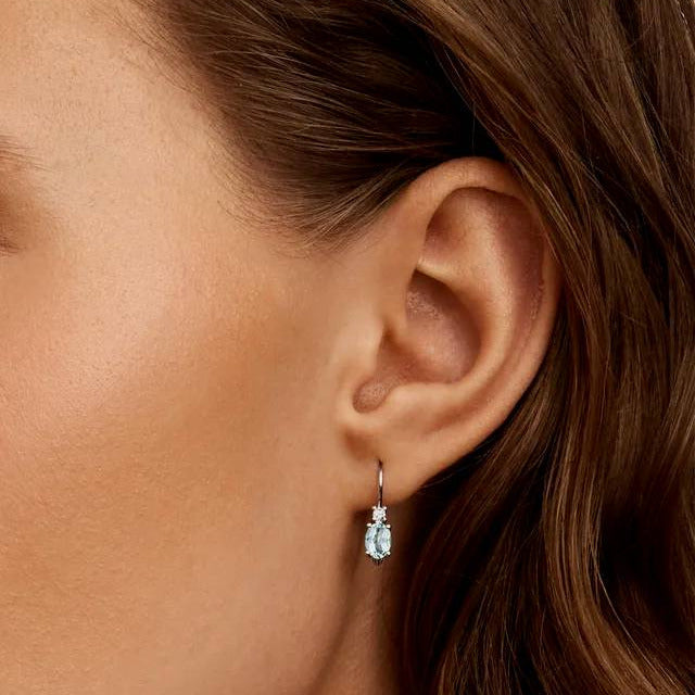 aquamarine earrings on ear