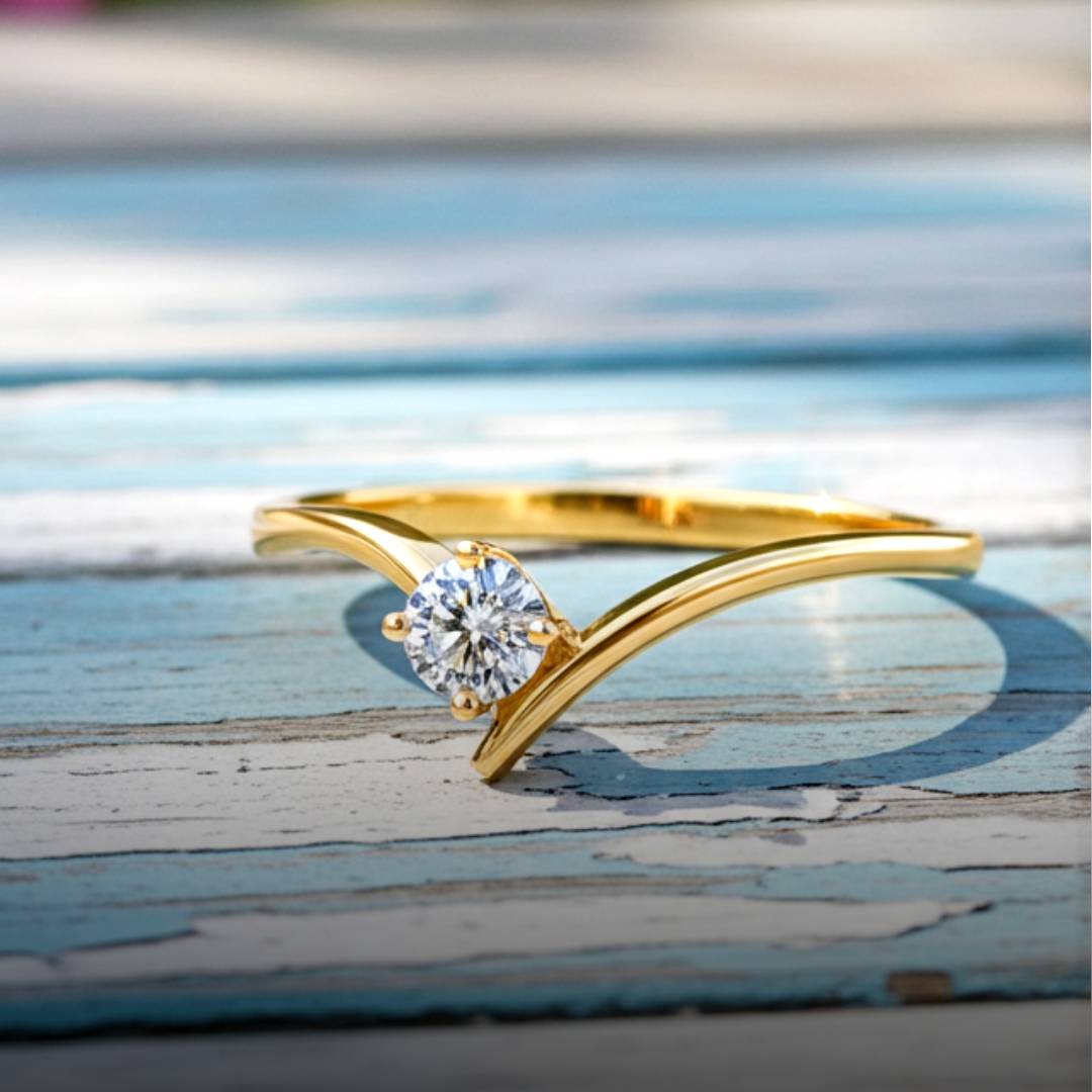 Gold ring with a diamond on a wood background