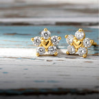 Gold earrings with heart and diamond design