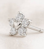 earrings with heart designs on a light background