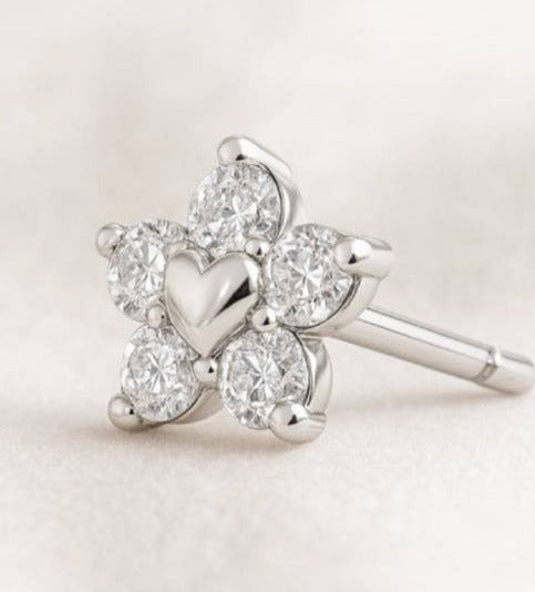 earrings with heart designs on a light background