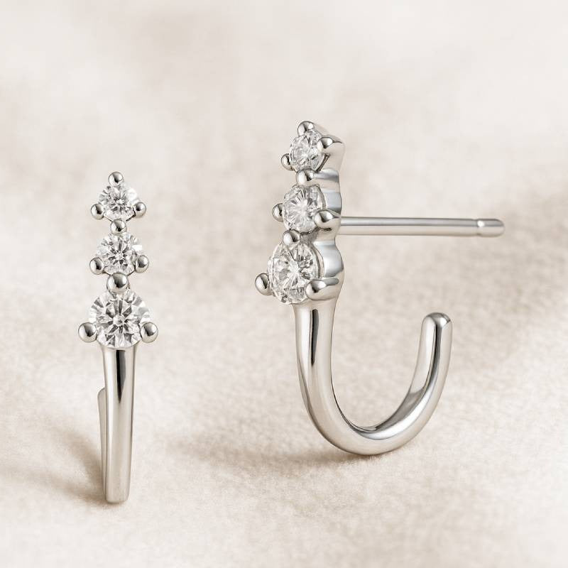 earrings with gemstones on a beige background