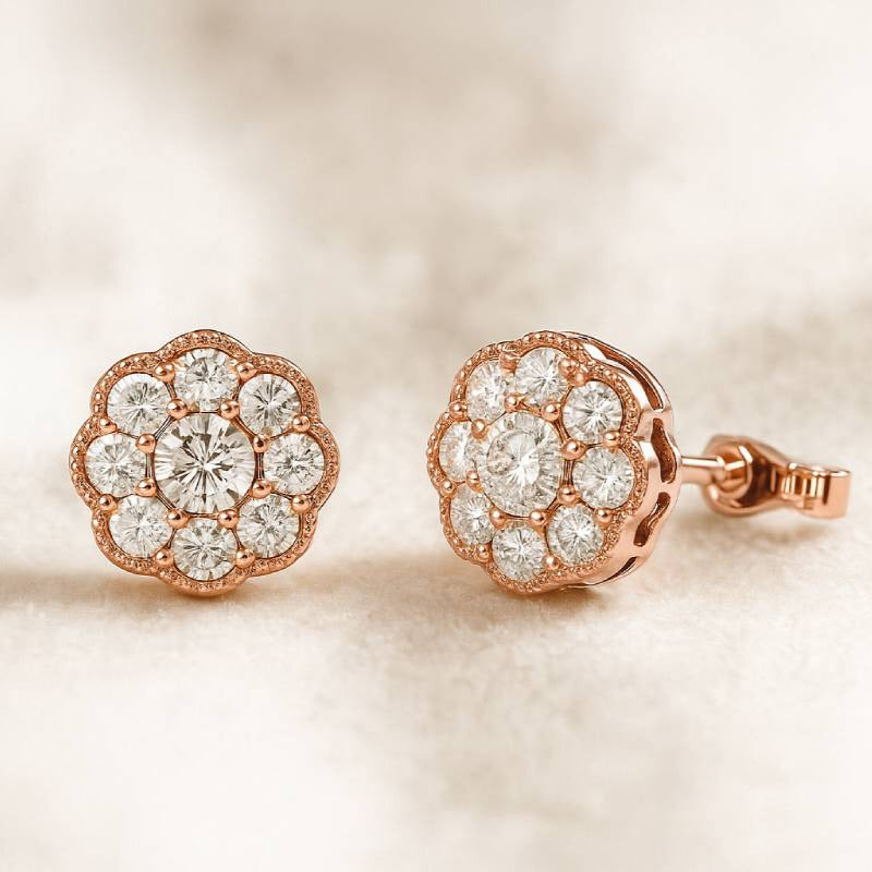 Rose gold earrings with diamond accents on a soft beige background