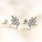  leaf-shaped earrings on a light beige background