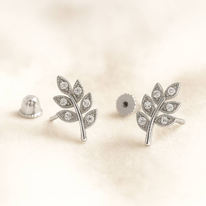  leaf-shaped earrings on a light beige background