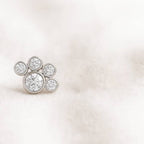 Diamond earring on a light pink background