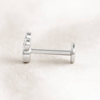 earring on a light beige background