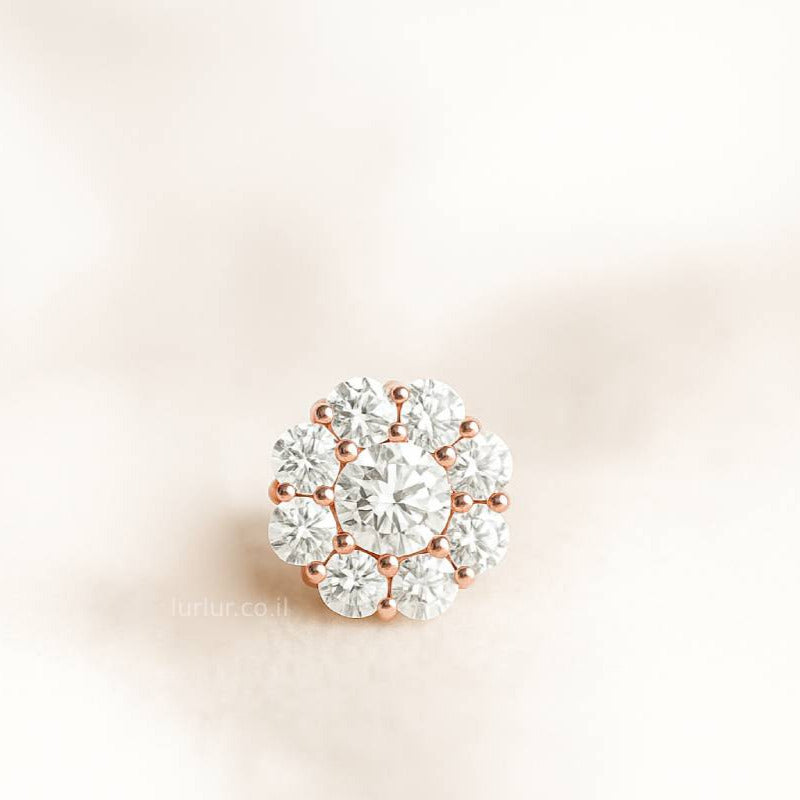 Diamond earring on a light pink background