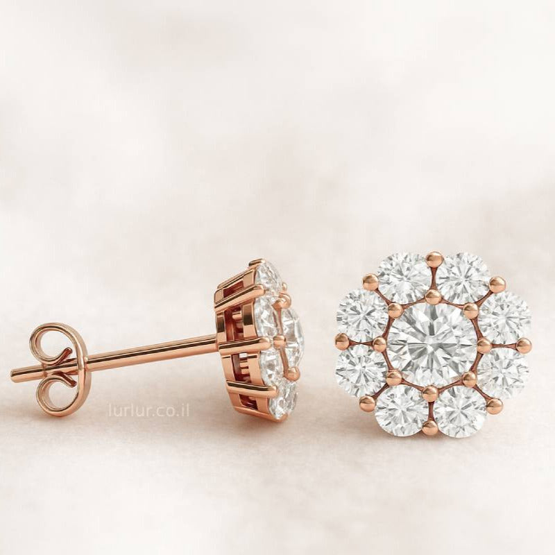 Rose gold earrings with clear diamonds
 on a light beige background