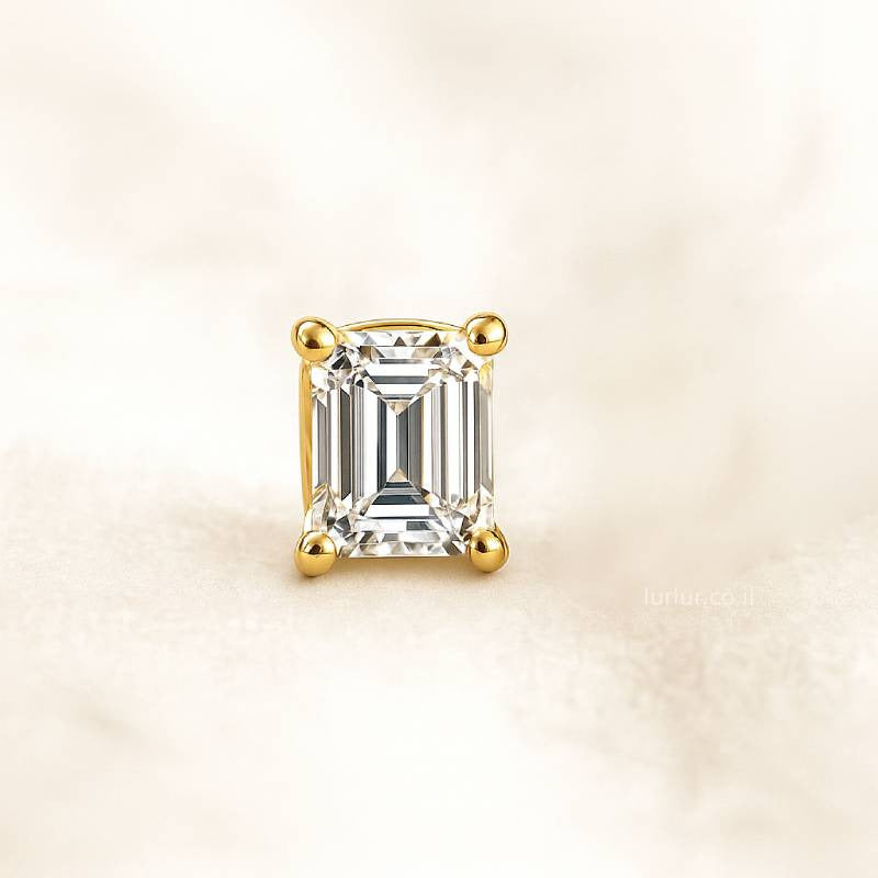 Gold ring with a diamond on a beige background