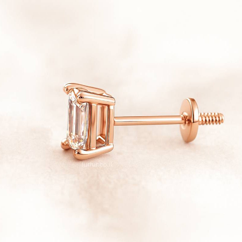 Rose gold emerald-cut stud earring on a light pink background