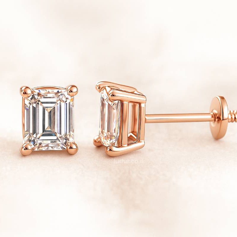 Rose gold emerald-cut earrings on a light beige background