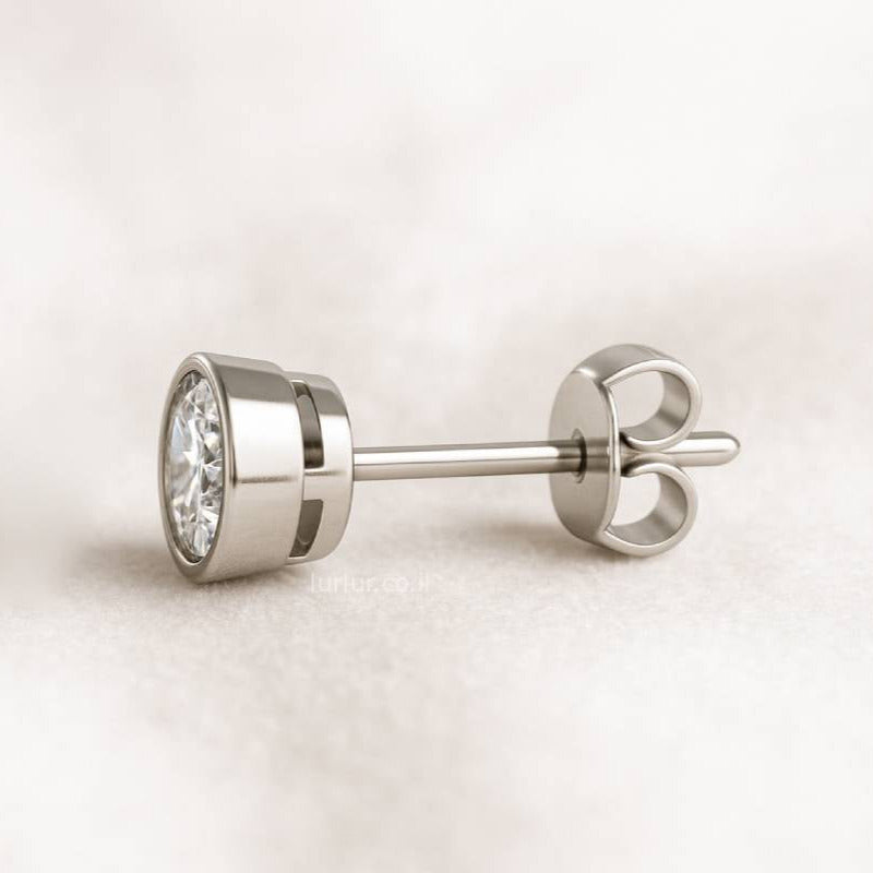 stud earring on a light beige background