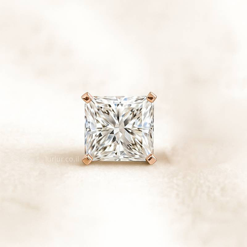 Square-cut diamond with rose gold prong setting on a light beige background