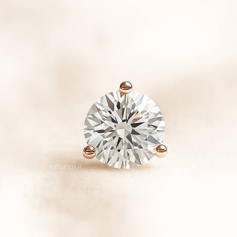 Round diamond with rose gold prongs on a beige background