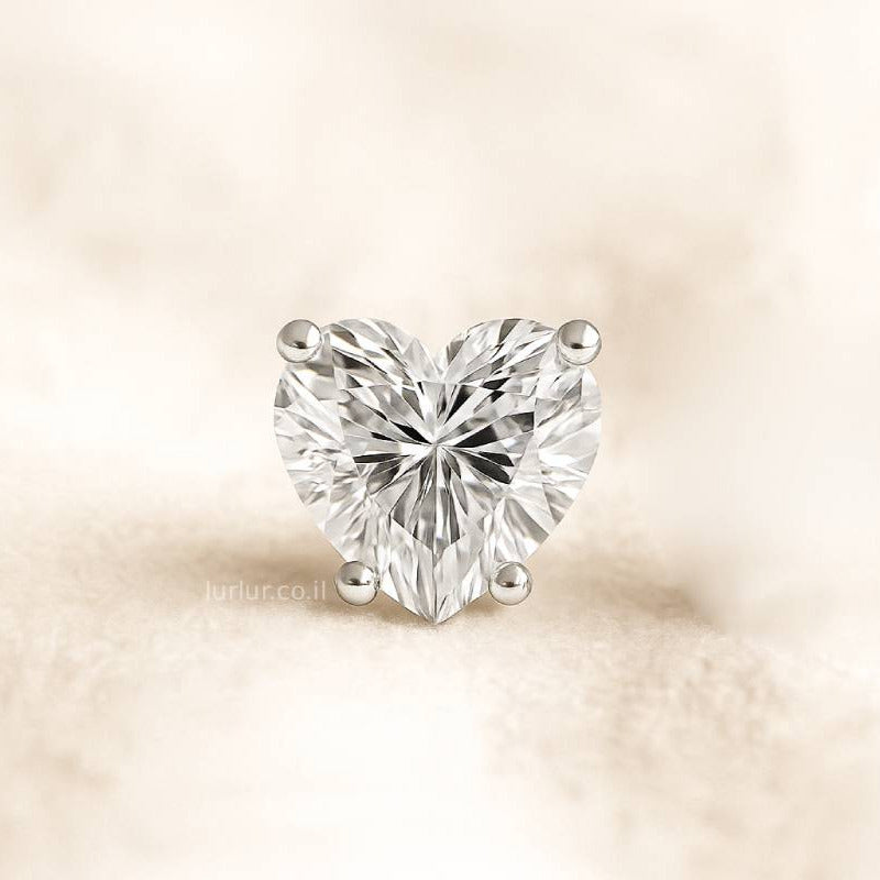 Heart-shaped diamond on a beige background