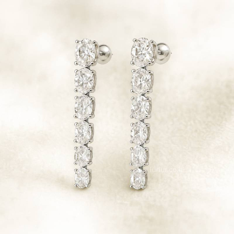 Pair of diamond earrings on a light background