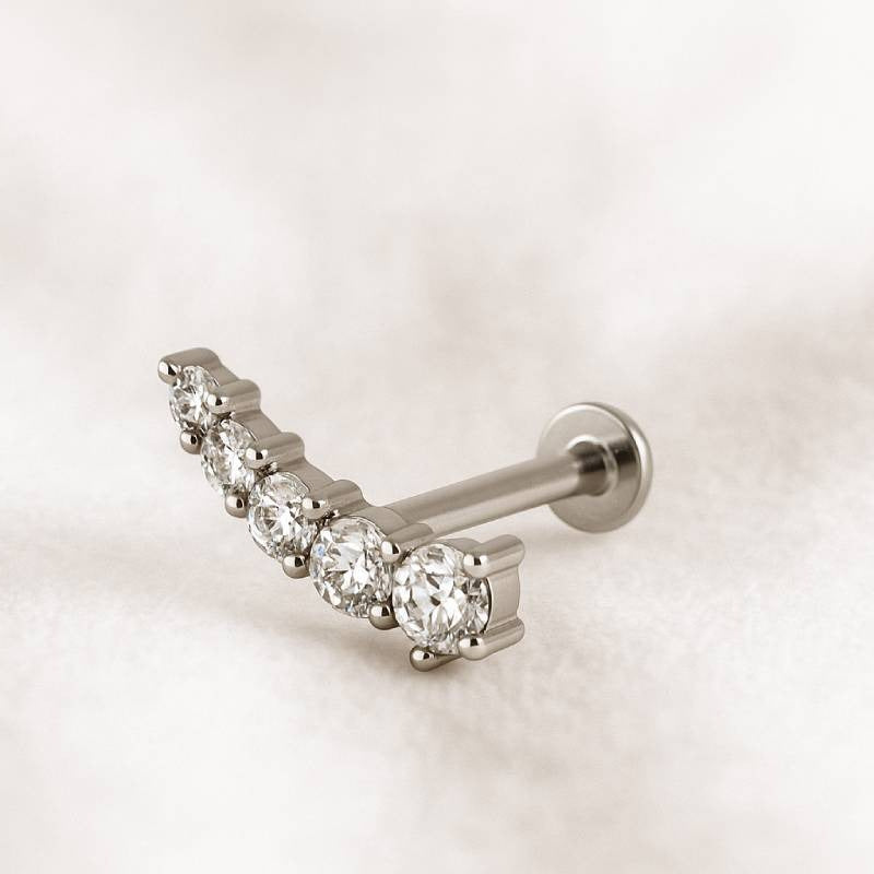 earring with clear gemstones on a light background