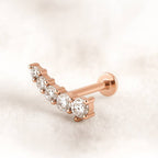 Rose gold and diamond earring on a light background