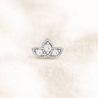 earring with clear diamonds on a light beige background