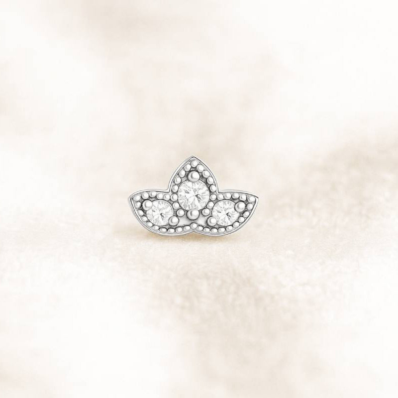 earring with clear diamonds on a light beige background