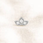 earring with clear gemstones on a light beige background