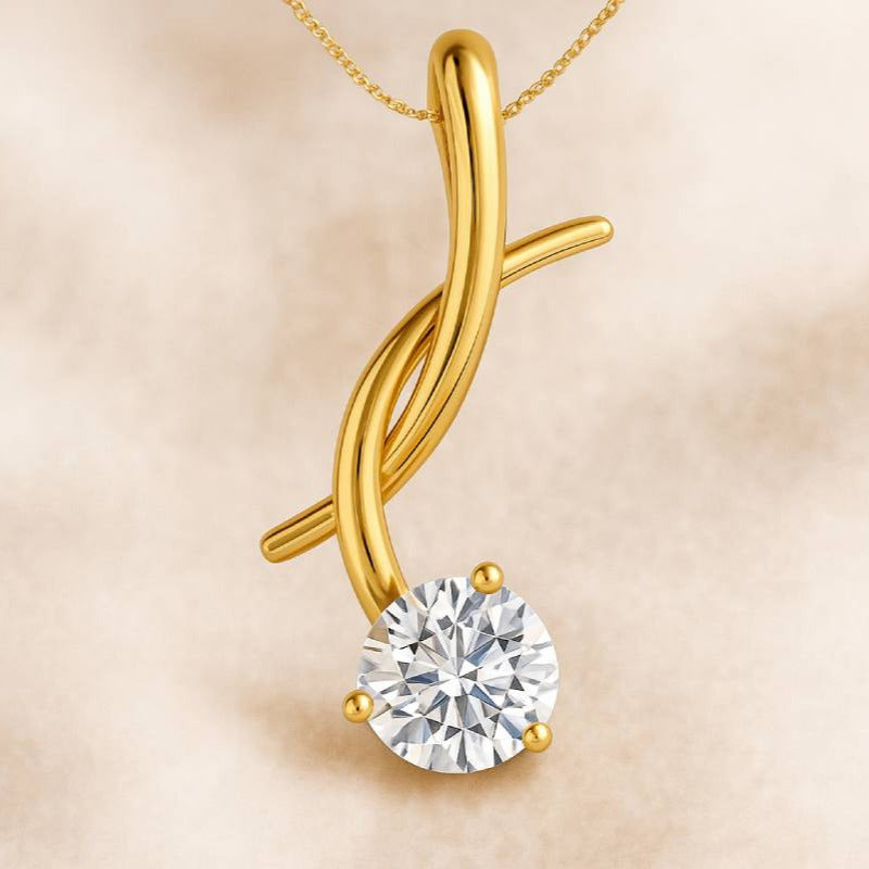 Gold pendant with a diamond on a beige background