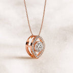 Rose gold diamond necklace on a light beige background