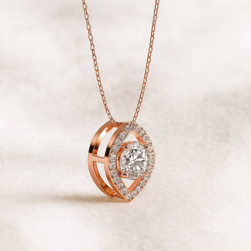 Rose gold diamond necklace on a light beige background