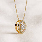 Gold necklace with a heart-shaped pendant on a light background