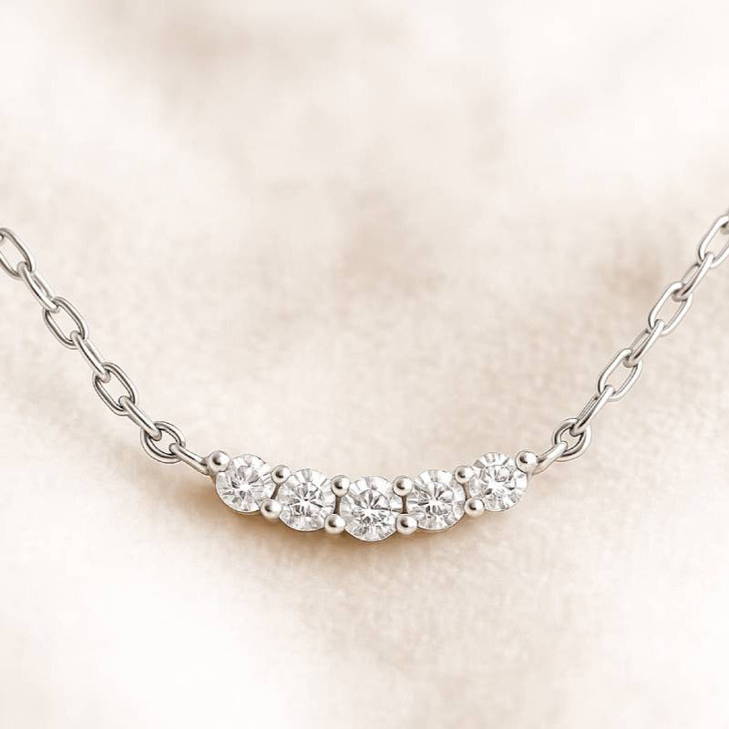 necklace with small diamonds on a beige background