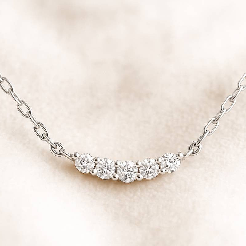 Diamond necklace on a beige background