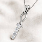 pendant with diamond accents on a soft white background
