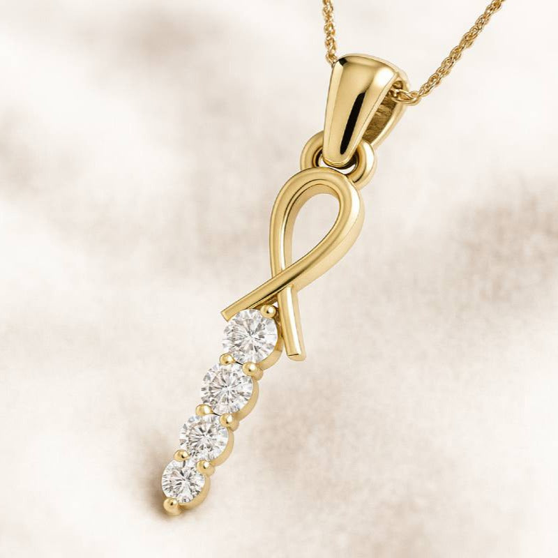 Gold pendant with diamonds on a beige background