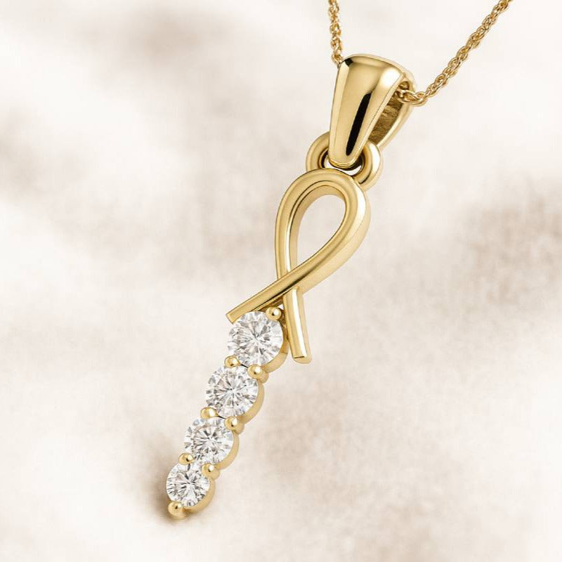 Gold pendant with diamonds on a beige background