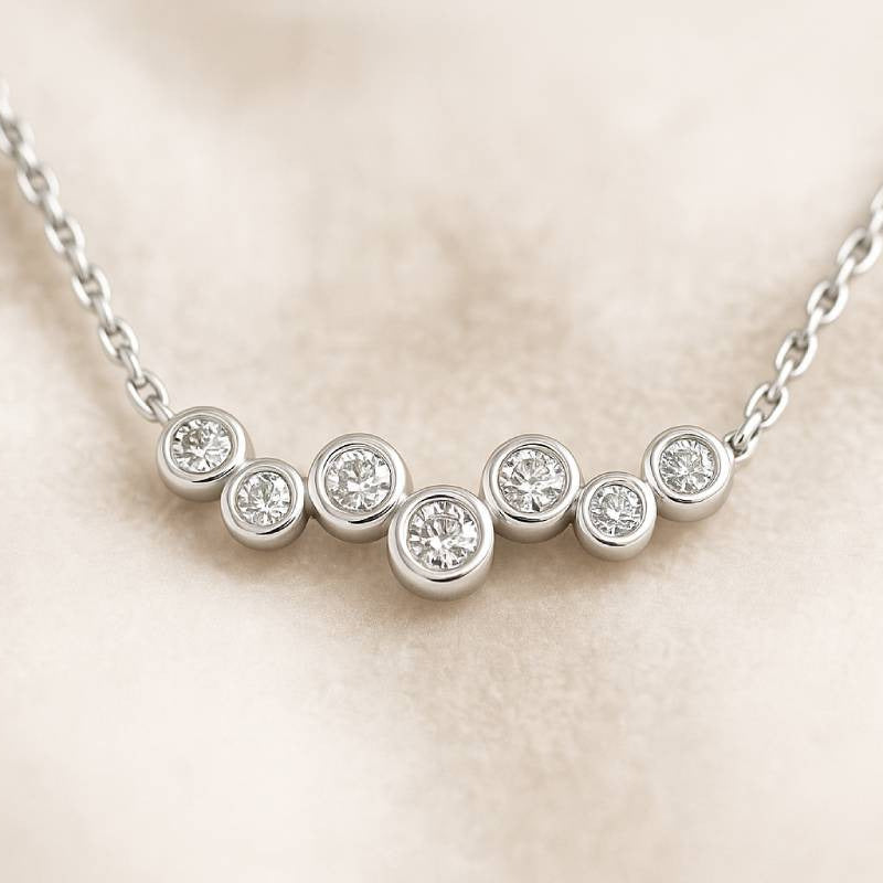 necklace with round diamonds on a beige background