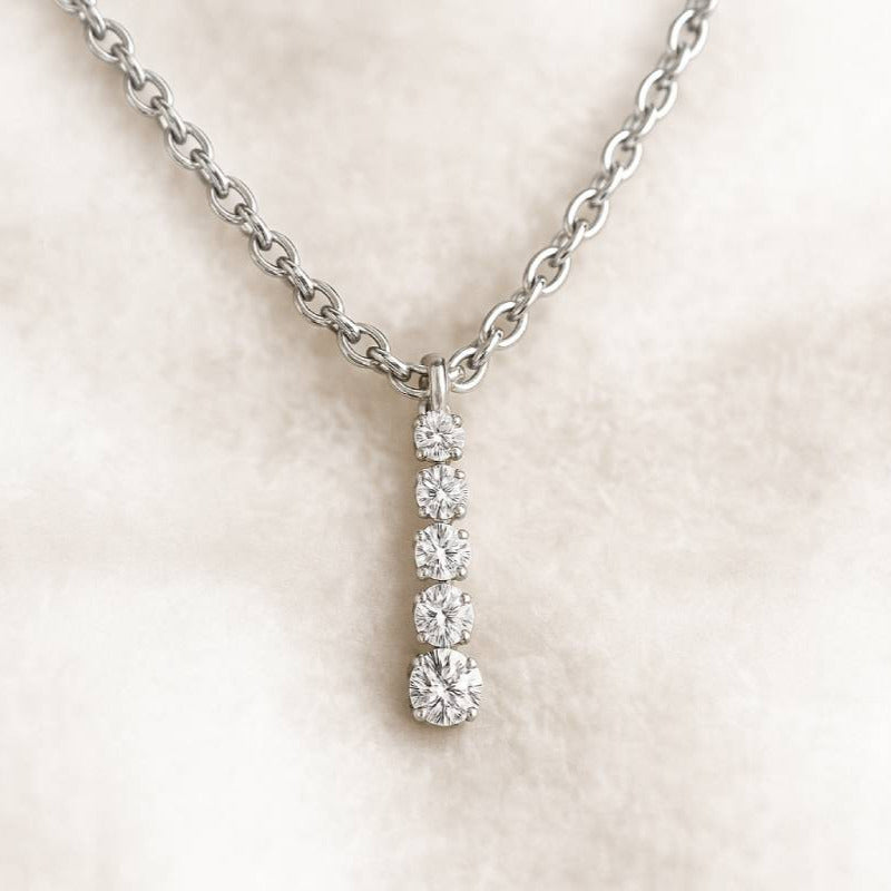 Diamond necklace on a light pink background