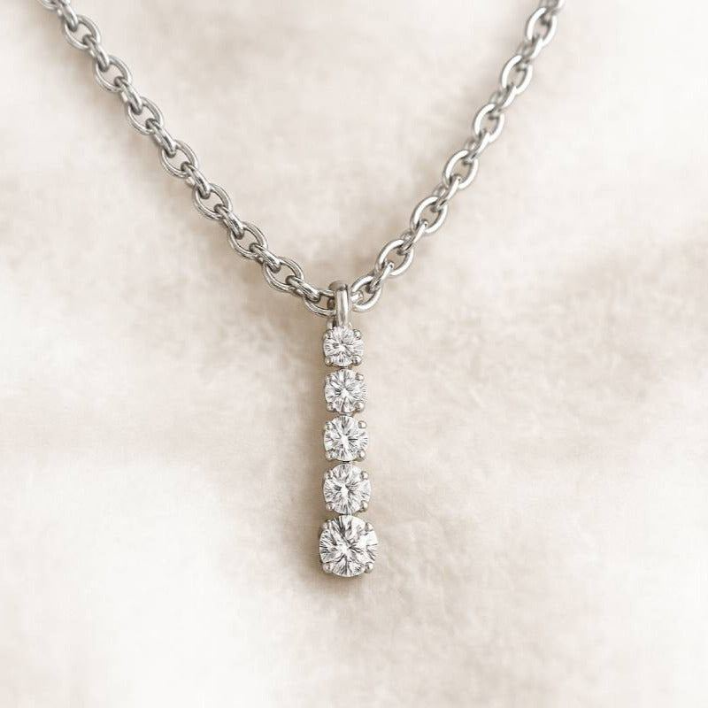 Diamond necklace on a light pink background