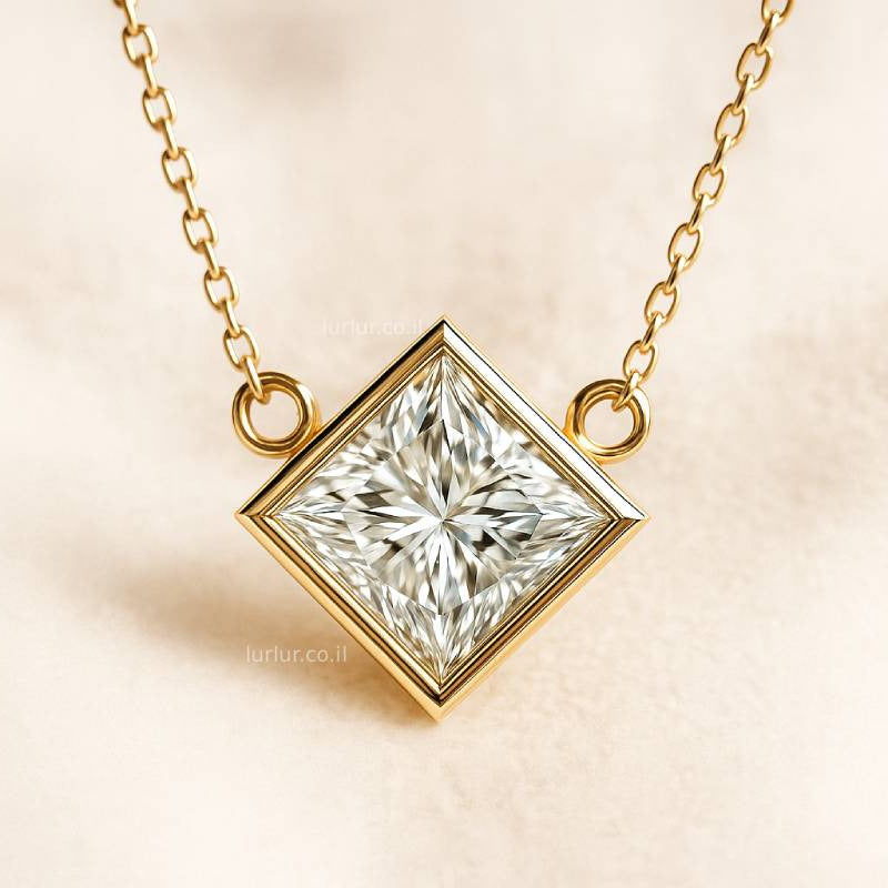 Gold necklace with a square-cut diamond pendant on a beige background