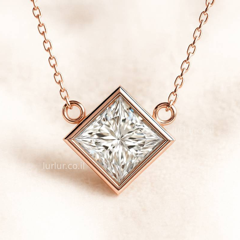 Rose gold necklace with a square-cut diamond pendant on a soft pink background