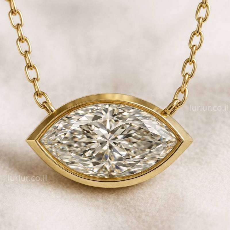 Gold necklace with a diamond pendant on a beige background