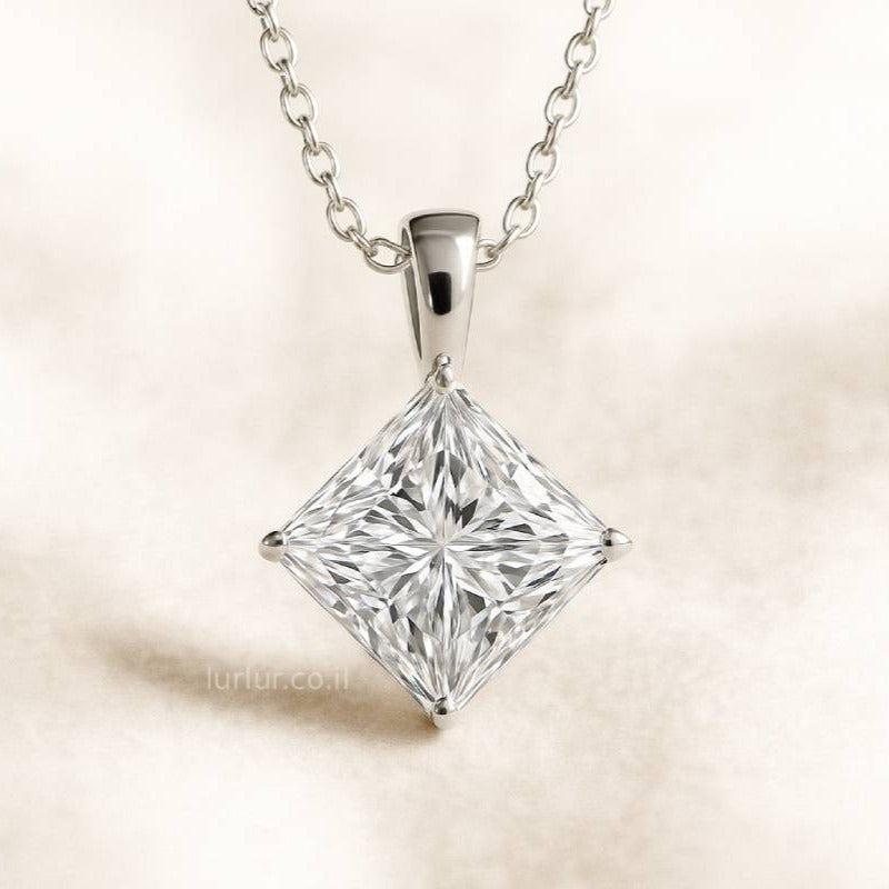 Princess cut diamond pendant on a beige background
