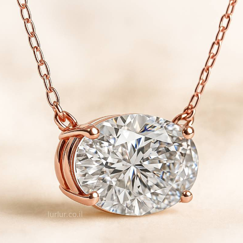 Rose gold necklace with a diamond pendant on a beige background