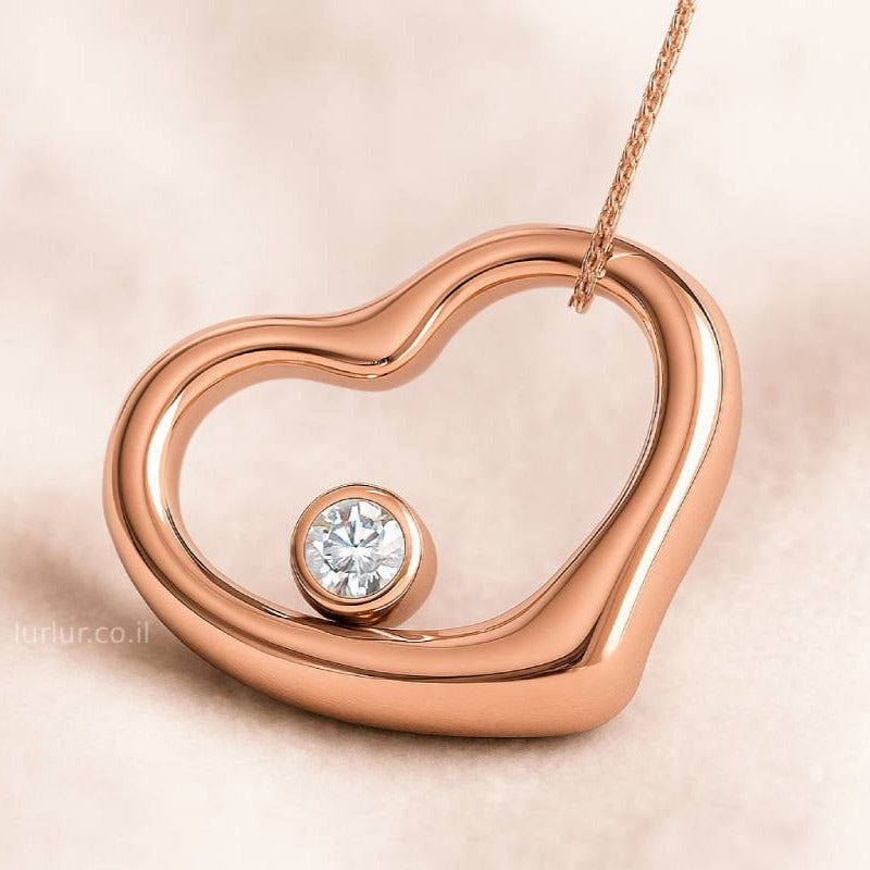 Rose gold heart-shaped pendant with a diamond on a beige background