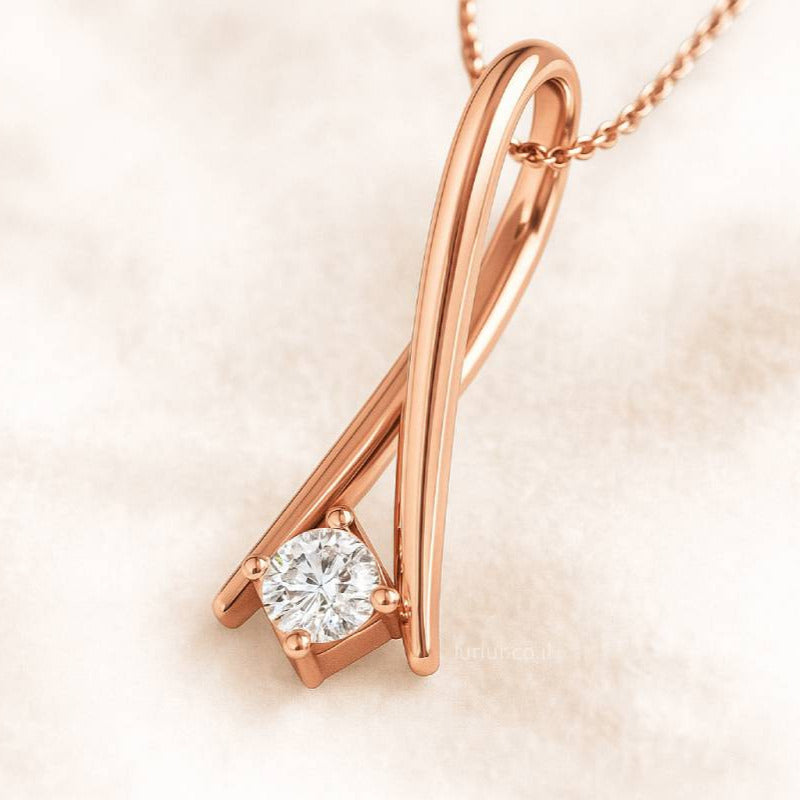 Rose gold necklace with a diamond pendant on a soft beige background