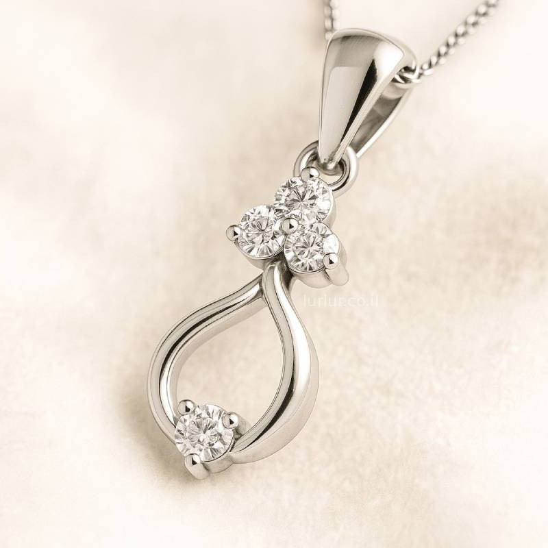 pendant with three diamond-like stones on a beige background