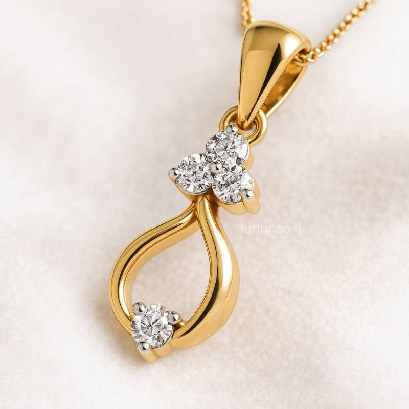 Gold pendant with diamonds on a light pink background