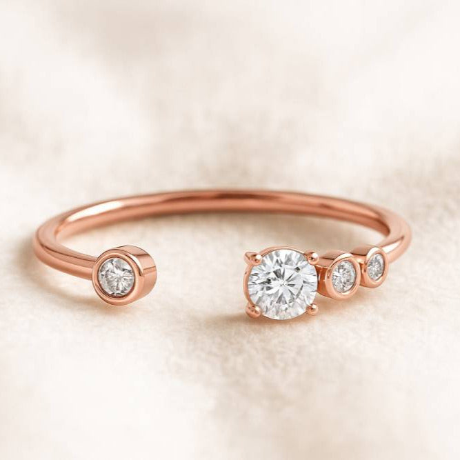 Rose gold ring with diamonds on a soft beige background