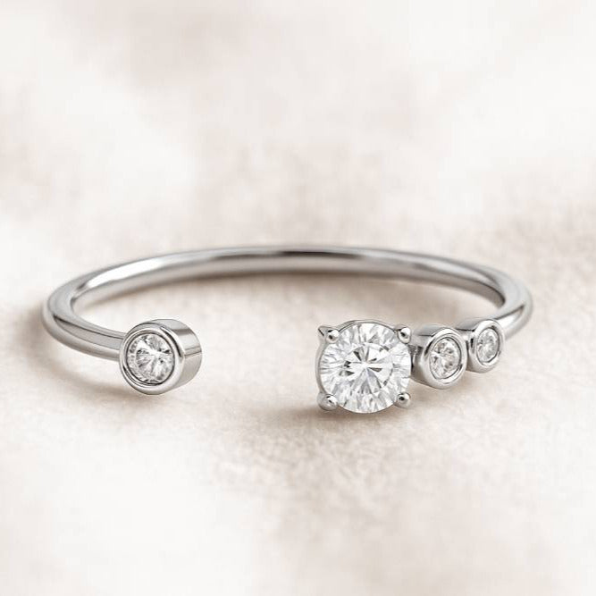 gold ring with diamonds on a light beige background