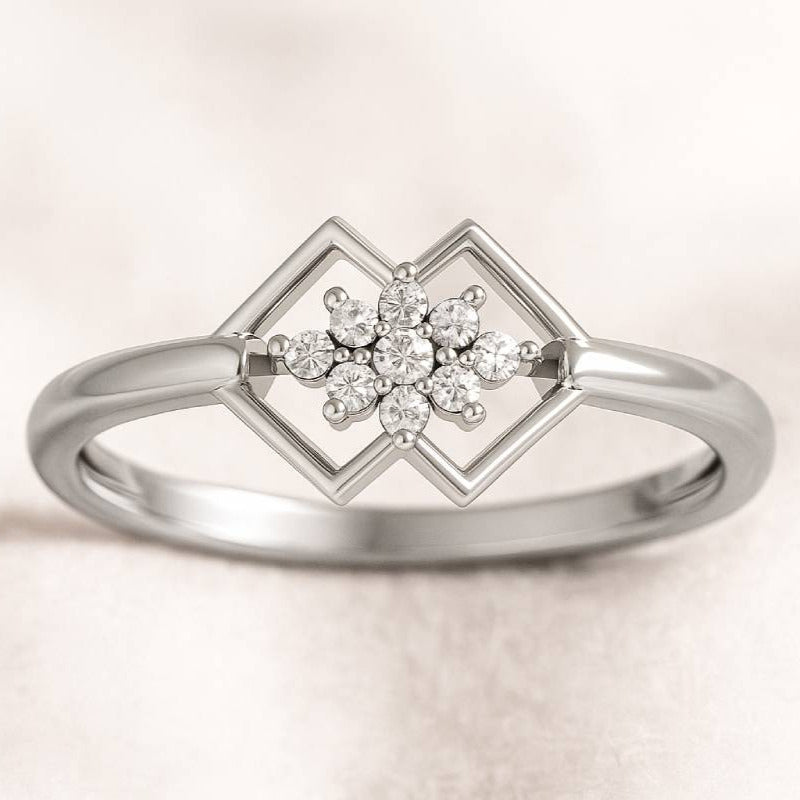 Gold ring with a diamond design on a light background